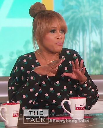 Eve’s black dotted print wrap top on The Talk