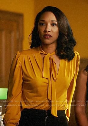 Iris's yellow tie neck blouse on The Flash