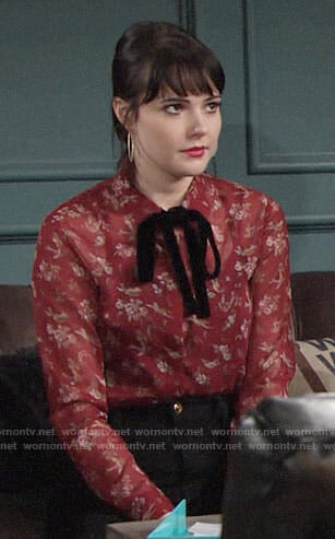 Tessa’s red floral blouse with velvet tie neck on The Young and the Restless