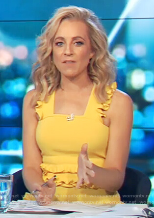 Carrie’s yellow ruffled top on The Project