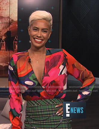 Sibley's floral top and green plaid skirt with chain on E! News