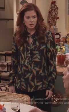 Grace’s black palm leaf print blouse and chandelier earrings on Will and Grace