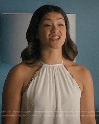 Jane’s white top with rainbow pom pom trim on Jane the Virgin