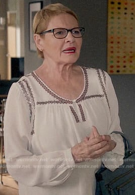 Joan’s white embroidered blouse on Life in Pieces