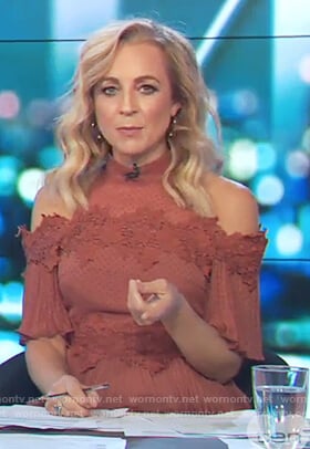 Carrie’s red cold shoulder ruffle dress on The Project