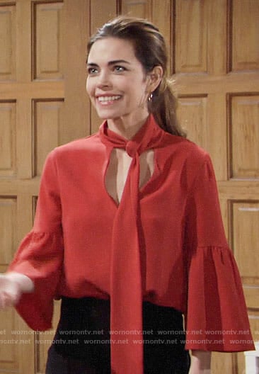 Victoria’s orange tie neck blouse on The Young and the Restless