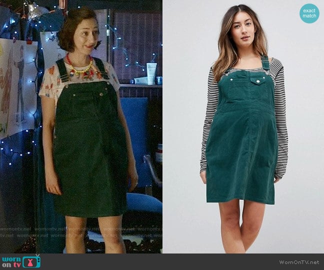 ASOS DESIGN Maternity cord overall dress in emerald green worn by Carol Pilbasian (Kristen Schaal) on Last Man On Earth