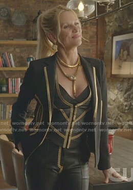 Alexis’w black jacket with gold trim and leather trousers on Dynasty