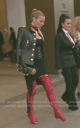 Dorit’s red over the knee lace-up boots and studded clutch on The Real Housewives of Beverly Hills