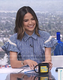 Erin’s blue striped ruffled sleeve shirt with pearls on E! News Daily Pop