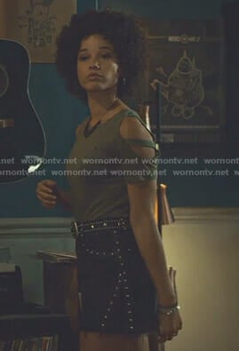 Maia’s khaki cold-shoulder tee and studded mini skirt on Shadowhunters