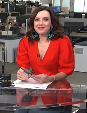 Melanie’s red wrap blouse and turquoise beaded earrings on Live from E!