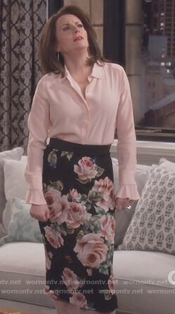 Karen’s pink ruffle cuff blouse and rose print skirt on Will and Grace