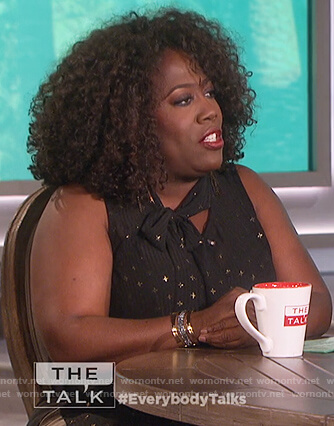 Sheryl’s black tie neck sleeveless top on The Talk