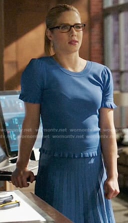 Felicity's blue ruffled trim top and pleated skirt on Arrow