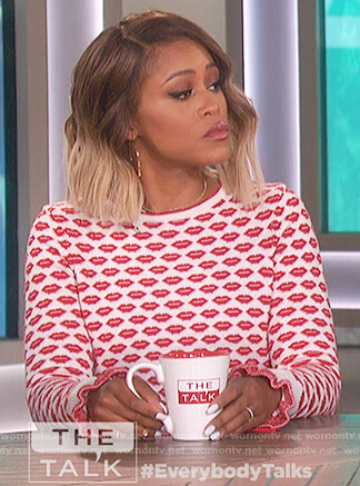Eve’s white and red lip print sweater on The Talk