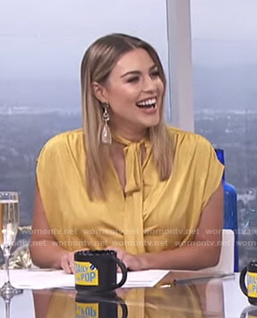 Carissa’s yellow tie neck top on E! News Daily Pop