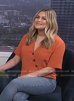 Carissa’s orange asymmetric shirt on E! News Daily Pop