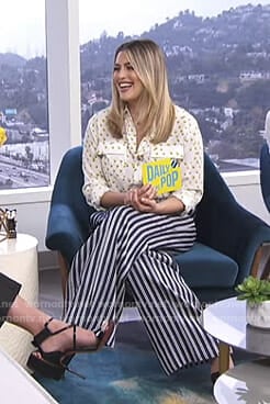 Carissa’s white printed blouse and striped pants on E! News Daily Pop