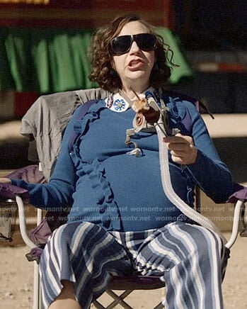 Carol's blue ruffled sweater and striped pants on Last Man on Earth