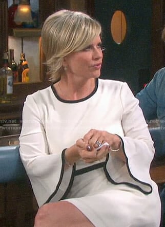 Kayla’s white bell-sleeve dress with black trim on Days of our Lives