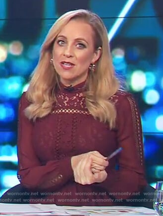 Carrie's maroon lace trim blouse on The Project