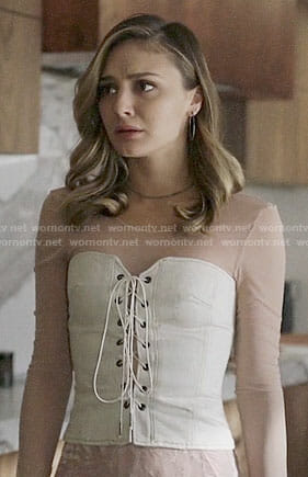 Megan’s white lace-up corset on The Arrangement