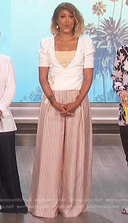 Eve's white puff shoulder top and striped metallic pants on The Talk