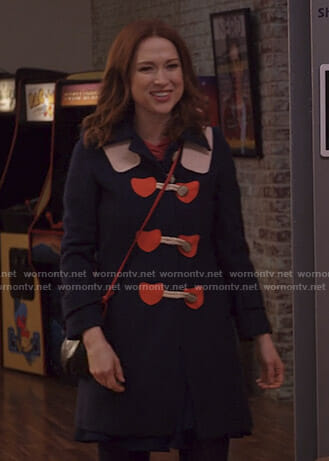 Kimmy’s navy coat with red hearts on Unbreakable Kimmy Schmidt