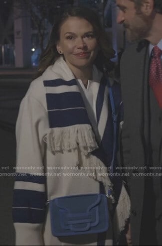 Liza’s white and blue striped fringe coat on Younger