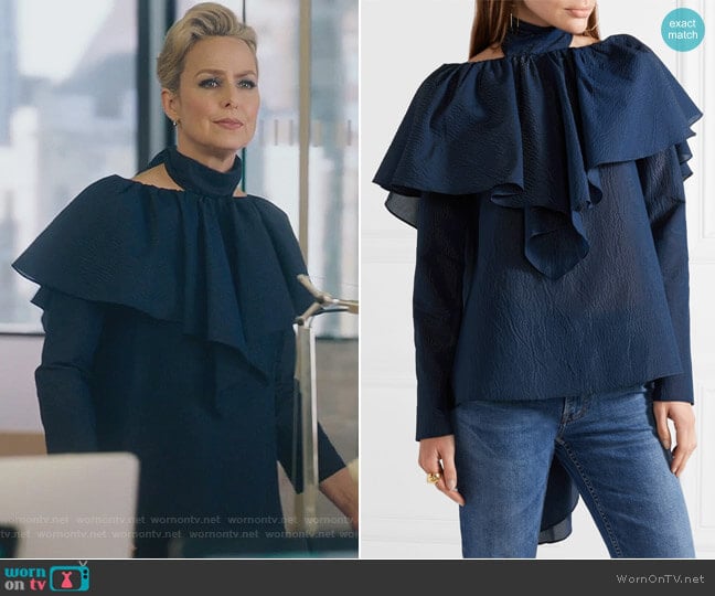 Napkin ruffled seersucker top by Rossie Assoulin worn by Jacqueline (Melora Hardin) on The Bold Type