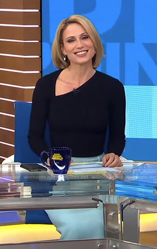 Amy’s black asymmetric v-neck top and skirt on Good Morning America