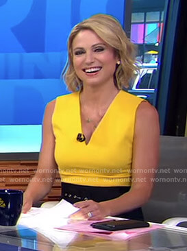 Amy’s yellow v-neck top and black belted skirt on Good Morning America