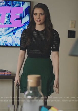 Jane’s black short sleeve sweater and green eyelet skirt on The Bold Type