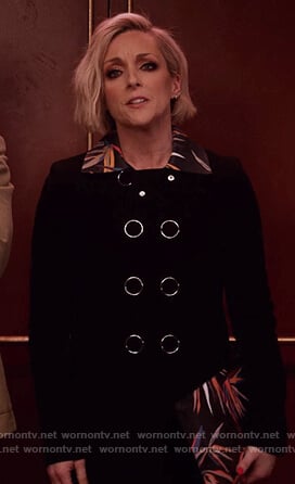 Jacqueline's black floral collared coat and printed clutch bag on Unbreakable Kimmy Schmidt
