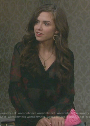 Ciara’s black rose print top and jeans with side bows on Days of our Lives
