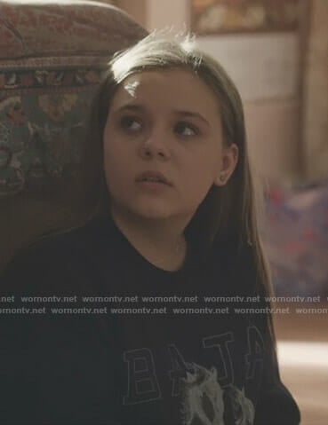 Daphne’s black Baja East horse print sweatshirt on Nashville