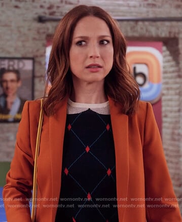 Kimmy’s navy diamond sweater on Unbreakable Kimmy Schmidt