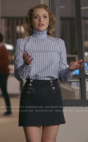 Eve's blue ruffled neck top on Supergirl