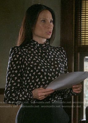 Joan’s black leaf print blouse on Elementary