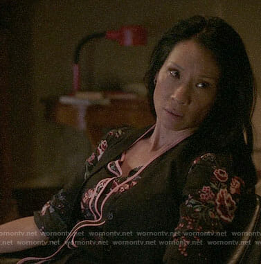 Joan’s black and pink floral tie neck blouse on Elementary