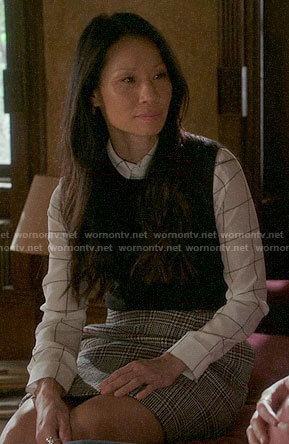 Joan's checked shirt and plaid skirt on Elementary