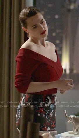 Lena’s red off-shoulder top and printed pencil skirt on Supergirl