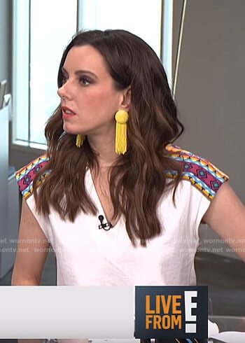 Melanie’s white v-neck top with embroidery on Live from E!