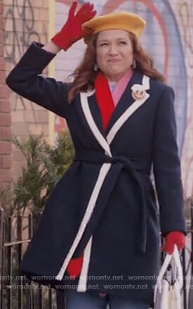 Kimmy’s navy tipped coat on Unbreakable Kimmy Schmidt