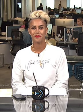 Sibley’s white Poesy NYC sweatshirt on Live from E!