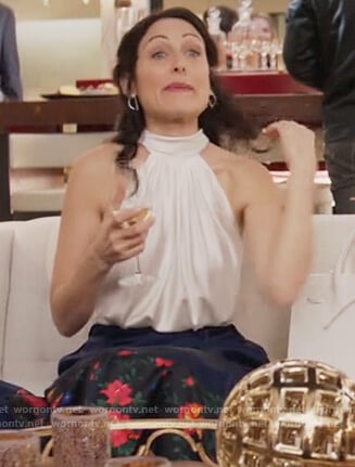 Abby’s white satin halter neck top on Girlfriends Guide to Divorce