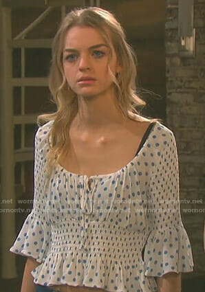 Claire’s white polka dot smocked top on Days of our Lives