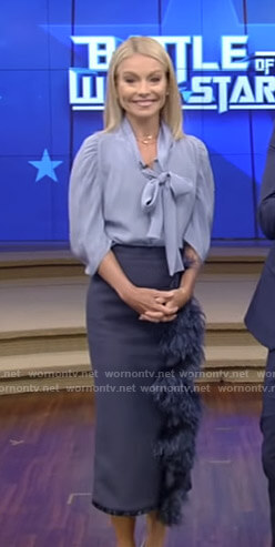 Kelly’s blue tie neck blouse and feather embellished skirt on Live with Kelly and Ryan