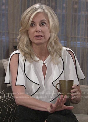 Ashley’s white ruffled blouse with black trim on The Young and the Restless